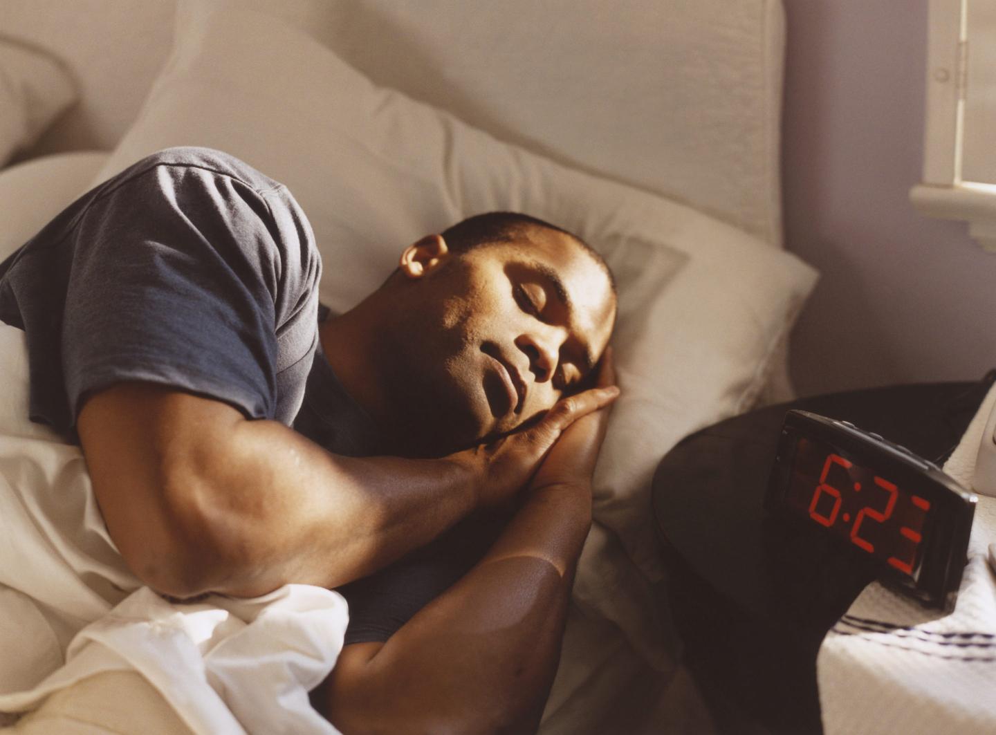 Man Sleeping in Bed
