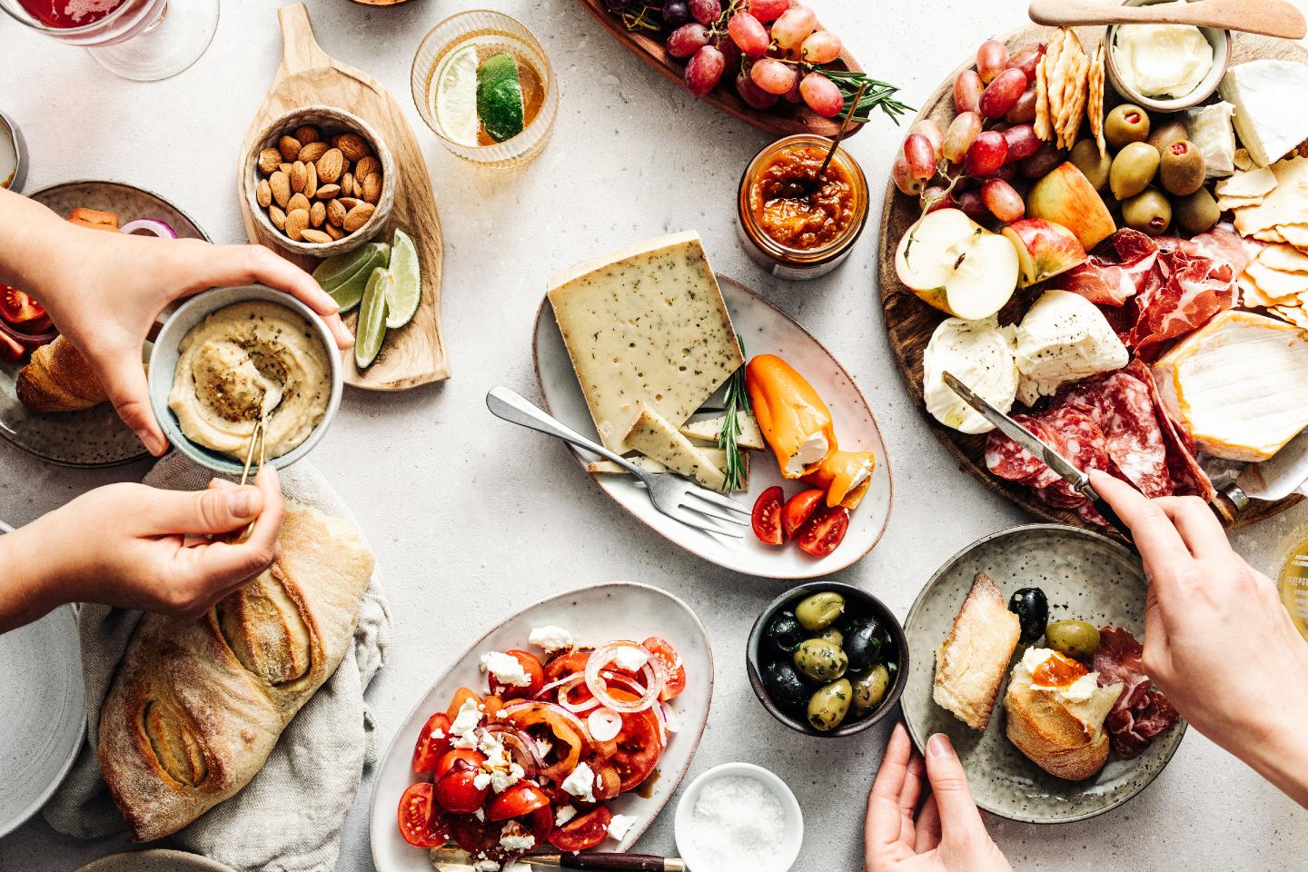 High angle view of fresh Mediterranean platters on table.