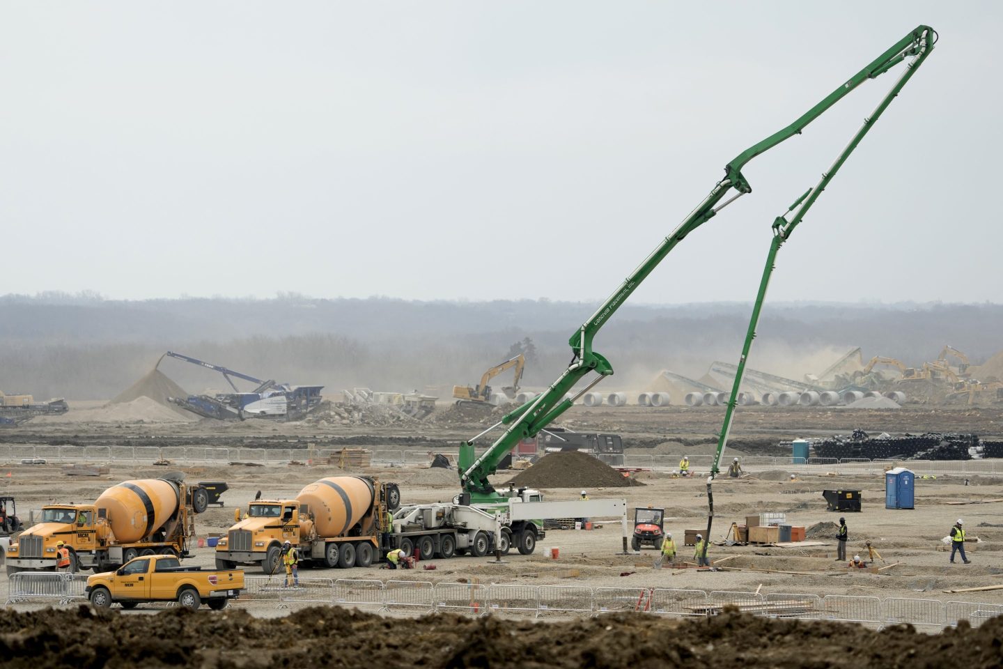 Workers prepare the site of a $4 billion Panasonic EV battery plant on Thursday near DeSoto, Kansas.