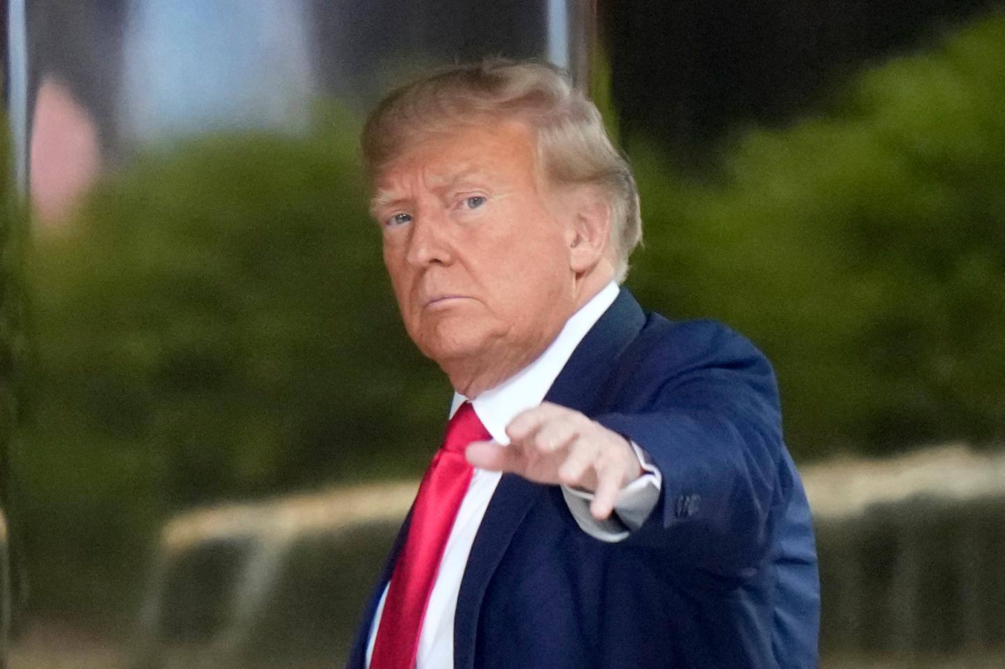 Donald Trump surrenders to authorities and pleads not guilty to 34 charges during criminal arraignment