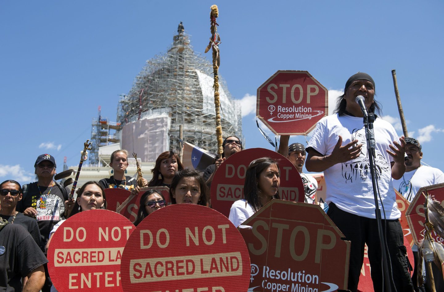 Tribal councilman Wendsler Nosie Sr. speaks with Apache activists during a rally to save Oak Flat, land near Superior, Ariz., sacred to Western Apache tribes, in front of the U.S. Capitol on July 22, 2015, in Washington.