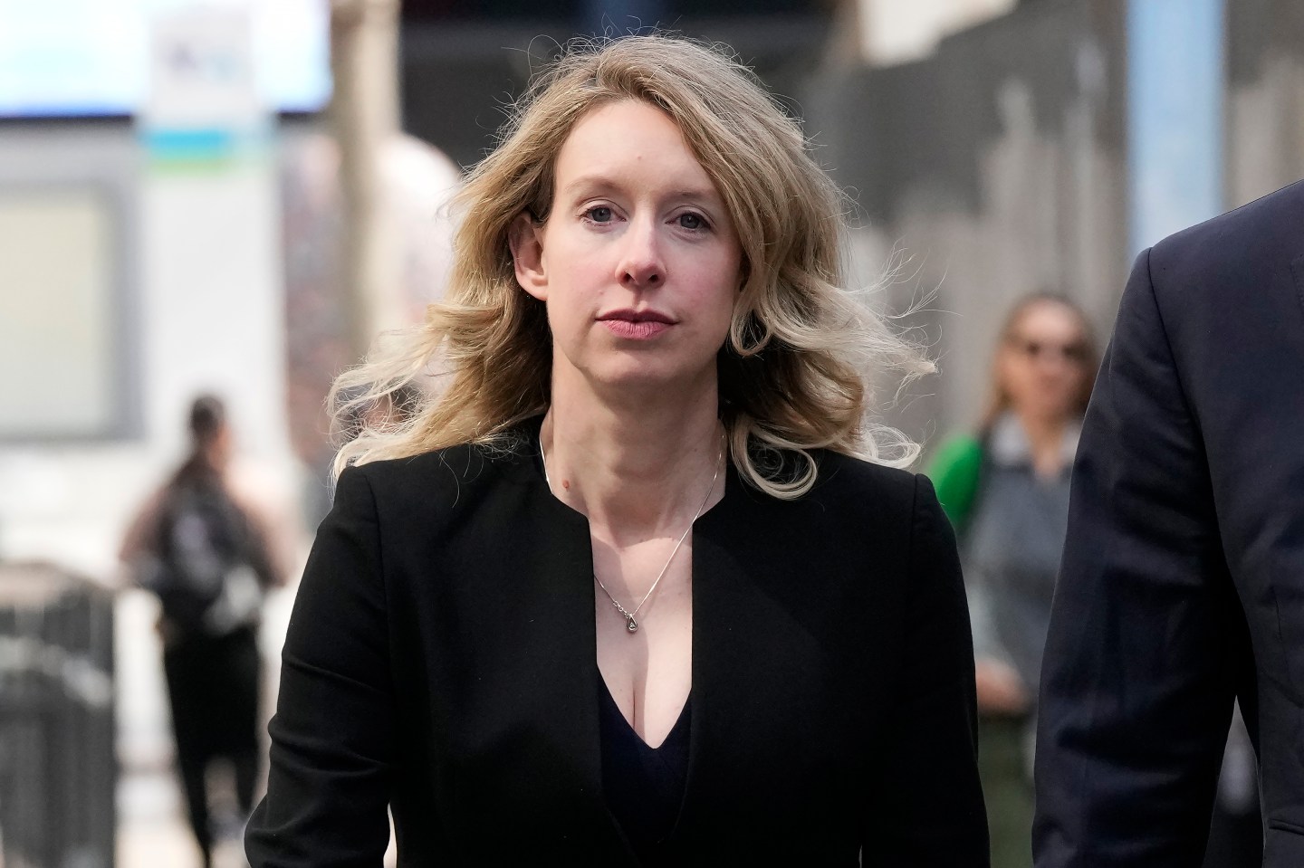 Former Theranos CEO Elizabeth Holmes leaves federal court in San Jose, Calif., March 17, 2023.