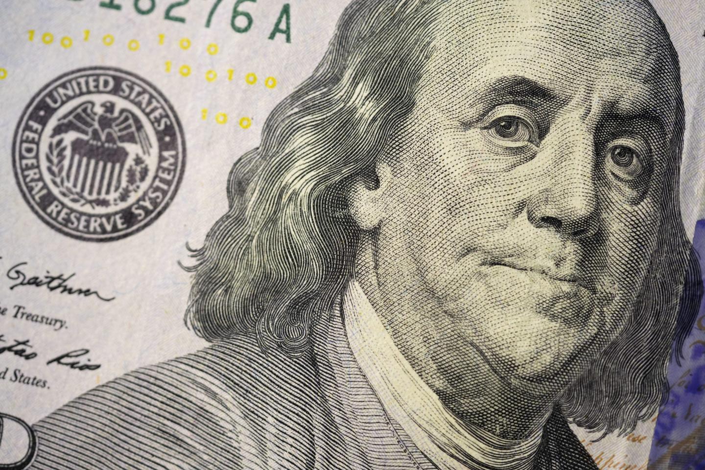 The likeness of Benjamin Franklin is seen on a U.S. $100 bill, Wednesday, Feb. 22, 2023, in Marple Township, Pa.