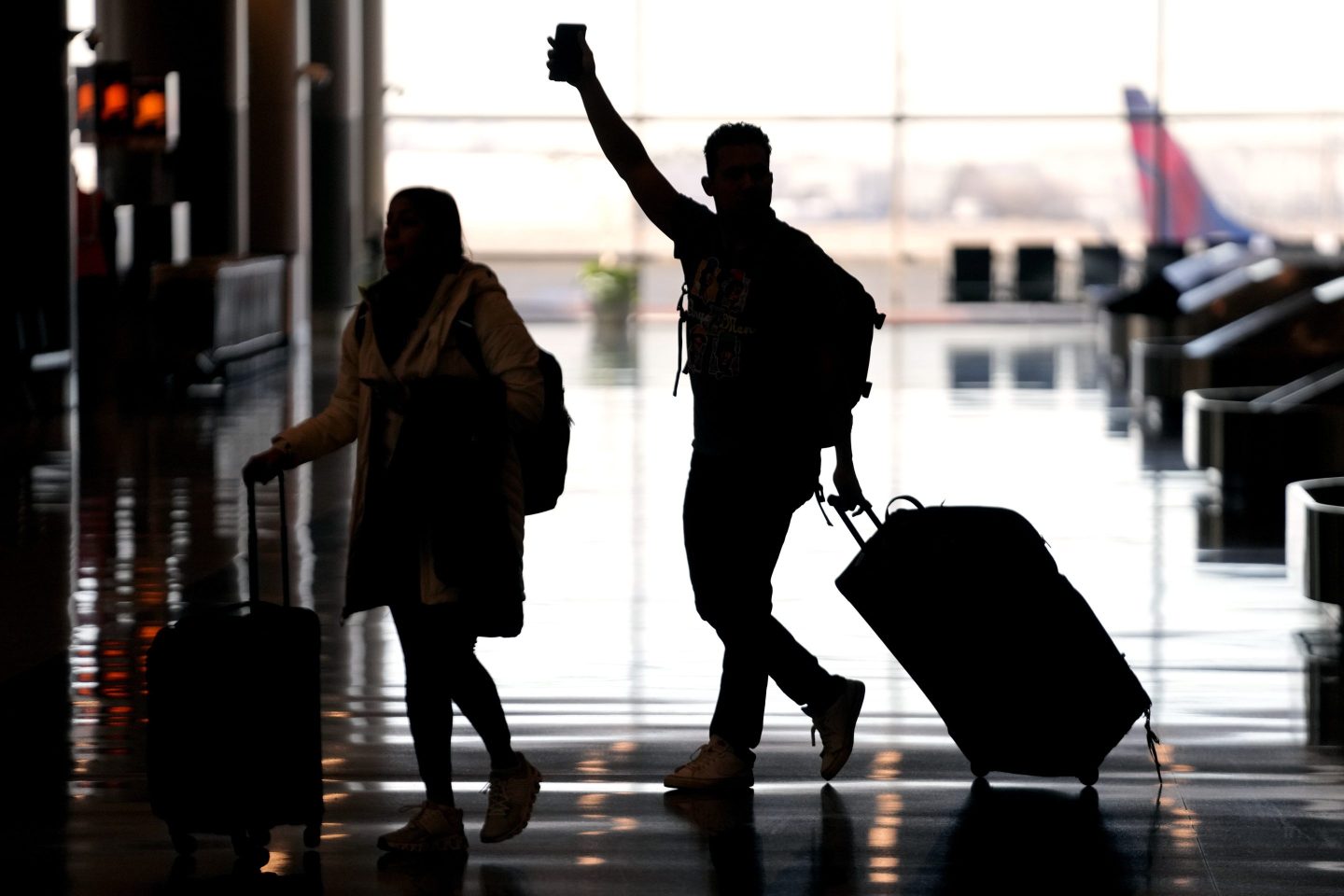 People pass through Salt Lake City International Airport on Jan. 11, 2023, in Salt Lake City.