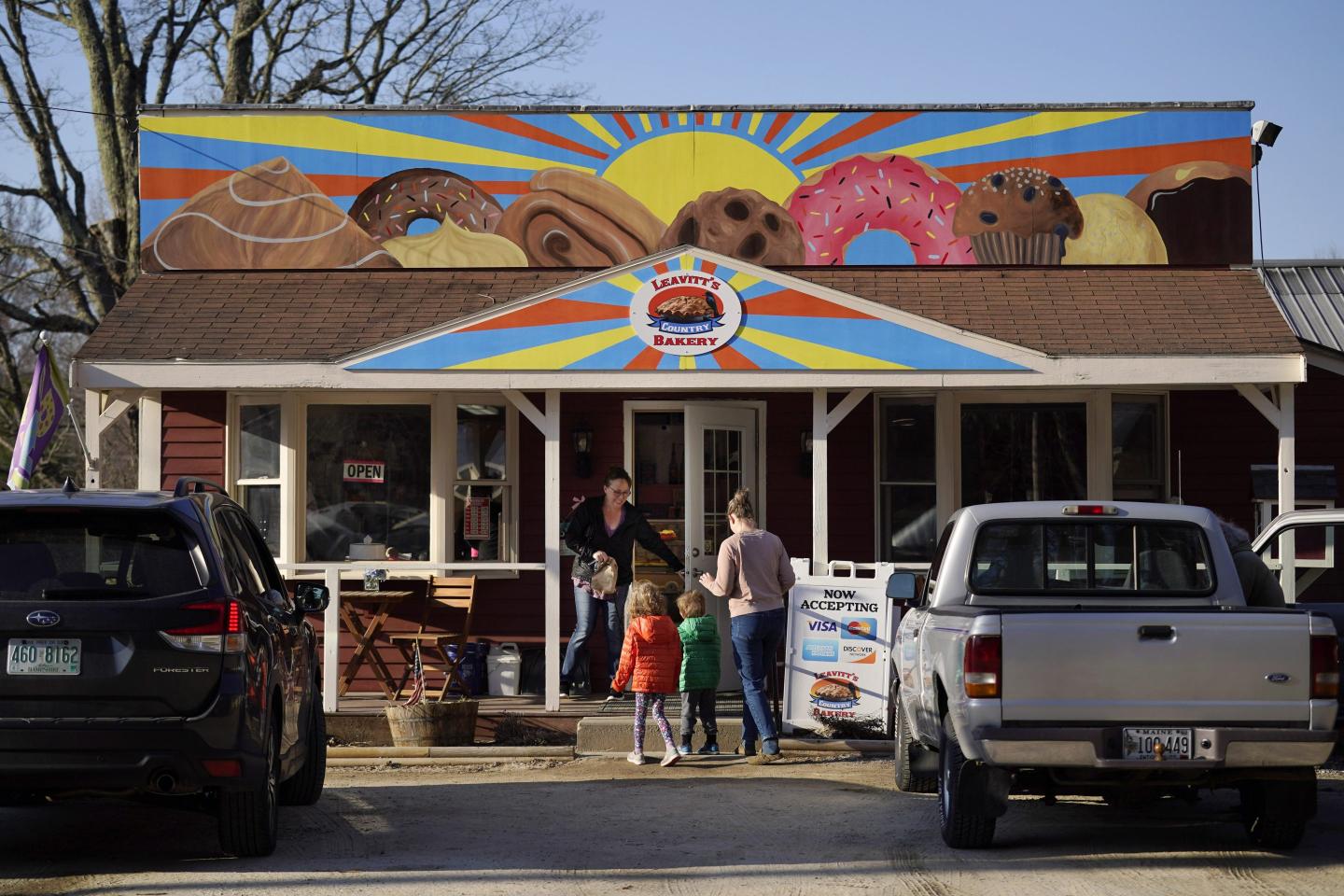 A donut shop owner is in a showdown with his town’s zoning board over a pastry mural and his right to free speech