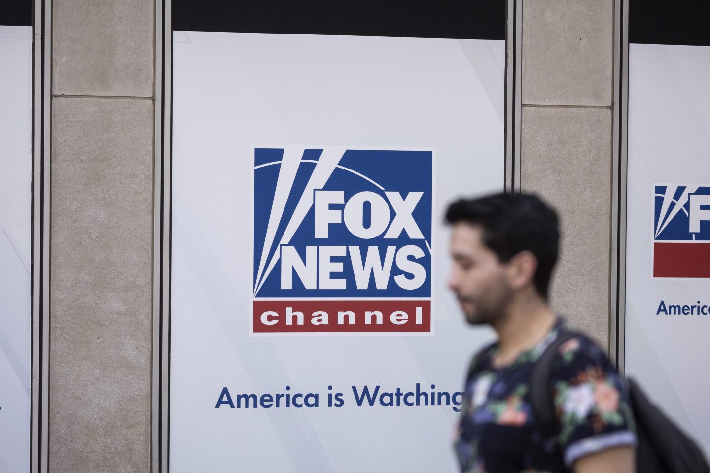 A person walks past the Fox News Headquarters in New York, April 12, 2023.