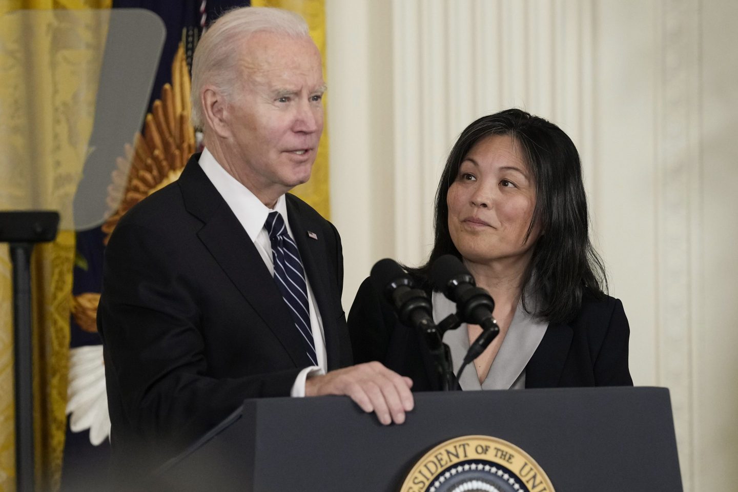 President Joe Biden talks about his nomination of Julie Su, right, to serve as the Secretary of Labor during an event in the East Room of the White House in Washington, on March 1, 2023.