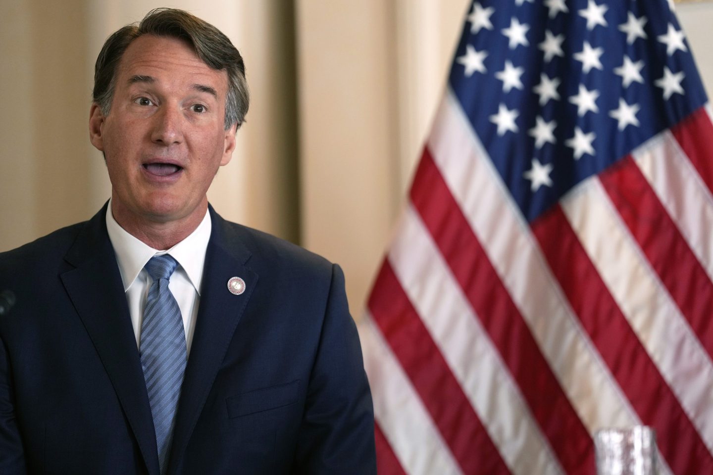 Virginia Governor Glenn Youngkin accompanying with U.S. Ambassador to Japan Rahm Emanuel and Micron Executive Vice President Manish Bhatia, both not in picture, speaks during a news conference about U.S.-Japan cooperation on economic issues, including the semiconductor supply chain Thursday, April 27, 2023, in Tokyo.