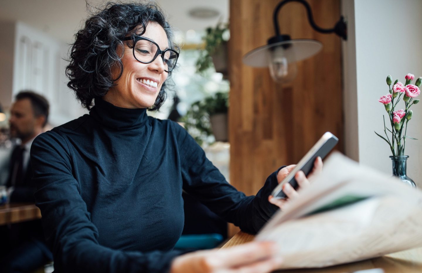 Woman happy reading emails on phone