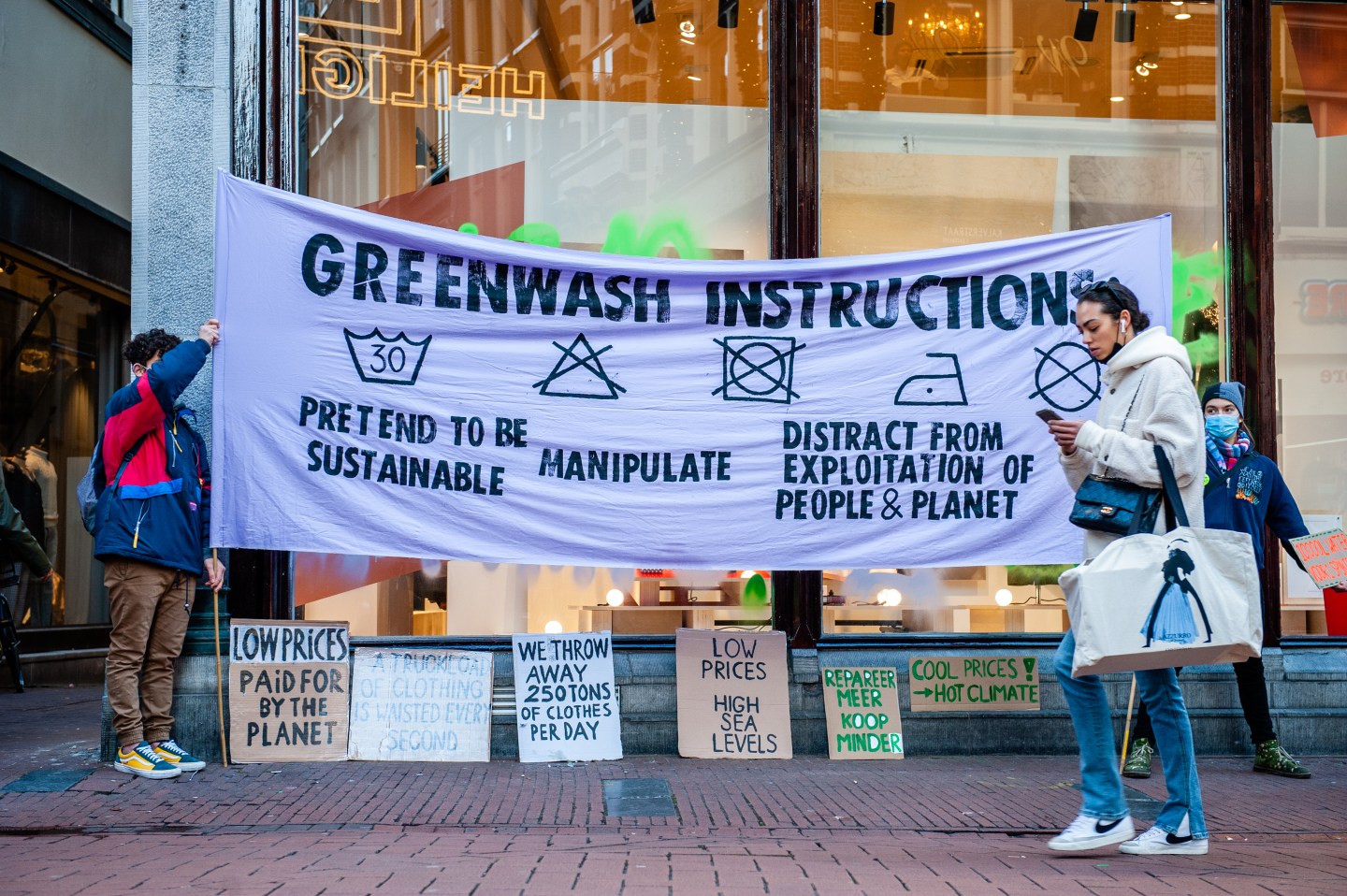 Activists protest greenwashing in Amsterdam on Nov. 25.