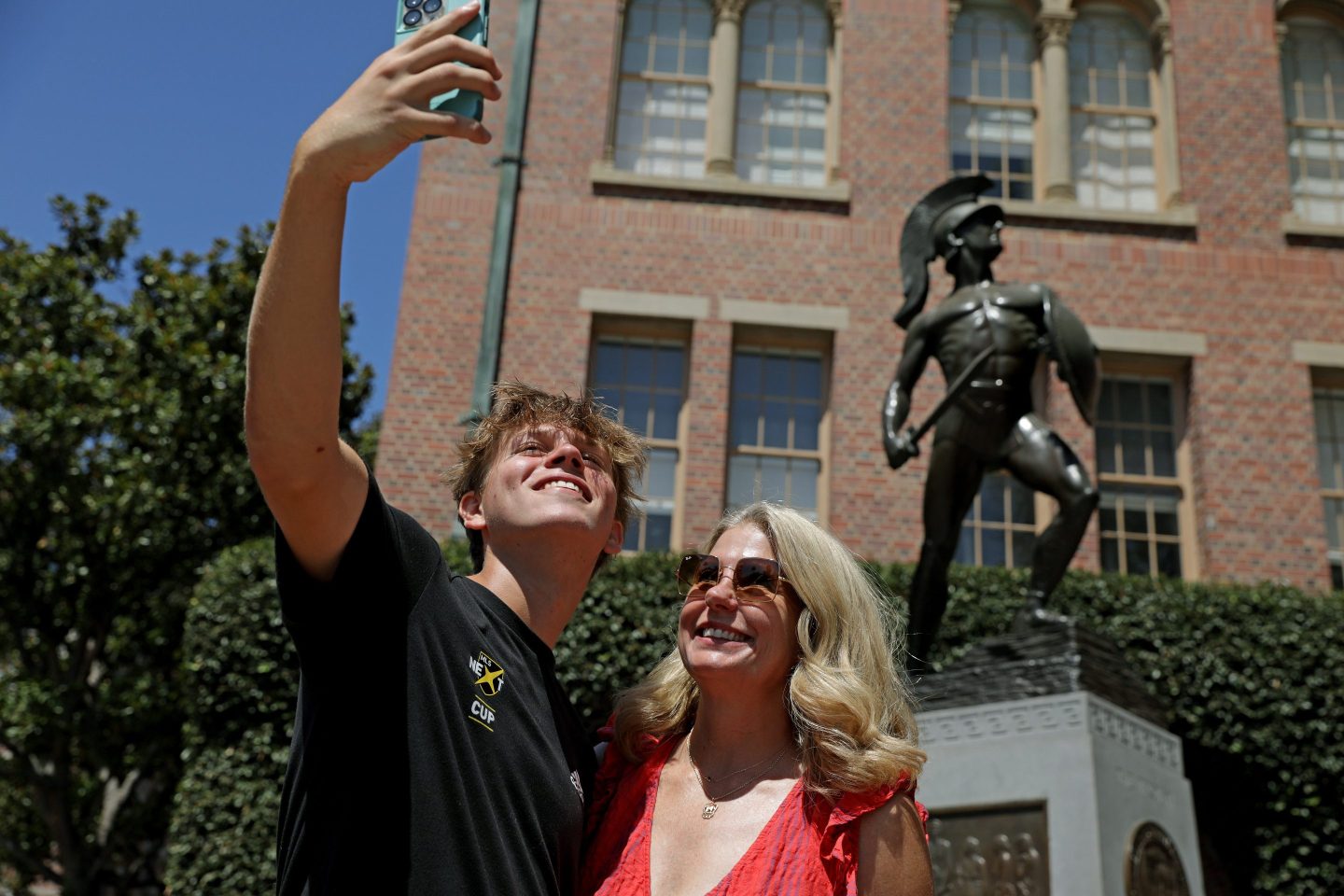 Ryan Angle, a USC freshman, left, takes a selfie with his mom Jennifer, a USC Alumni, on move-in day on August 17, 2022