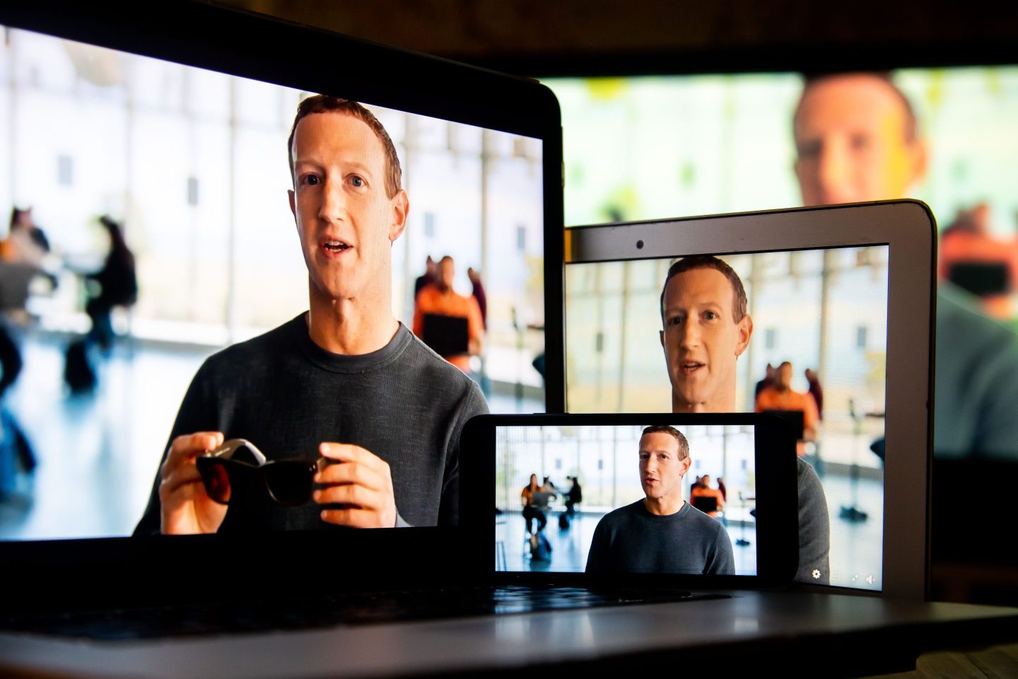 Mark Zuckerberg on multiple device screens