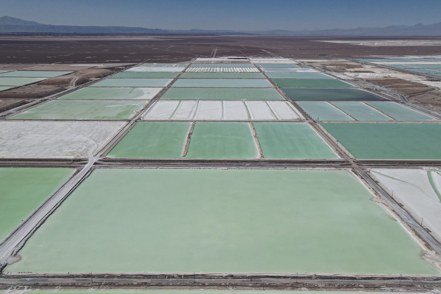 Brine pools stretching across a lithium mine in Chile’s Atacama Desert.
