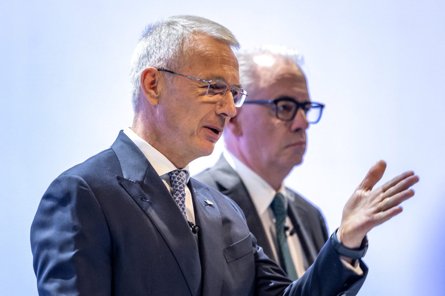Credit Suisse chairman Axel Lehmann (L) gestures next to Credit Suisse CEO Ulrich Korner at the end of the last annual general meeting of Credit Suisse bank, in Zurich, on April 4, 2023, following the takeover by UBS of Credit Suisse hastily arranged by the Swiss government on March 19 to prevent a financial meltdown.
