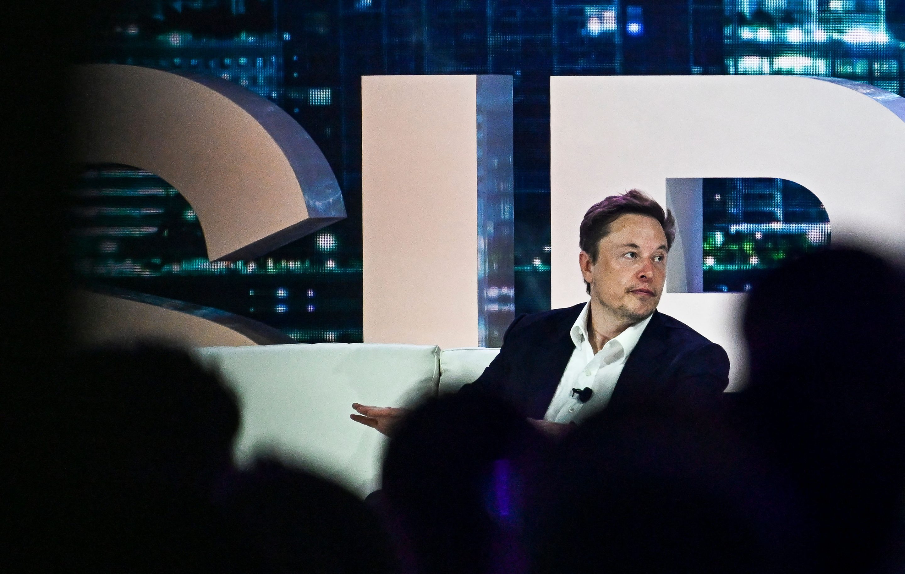 Twitter CEO Elon Musk has finally purged the legacy blue checks as promised. Here, he talks to advertisers at a marketing conference in Miami on April 18, 2023. 