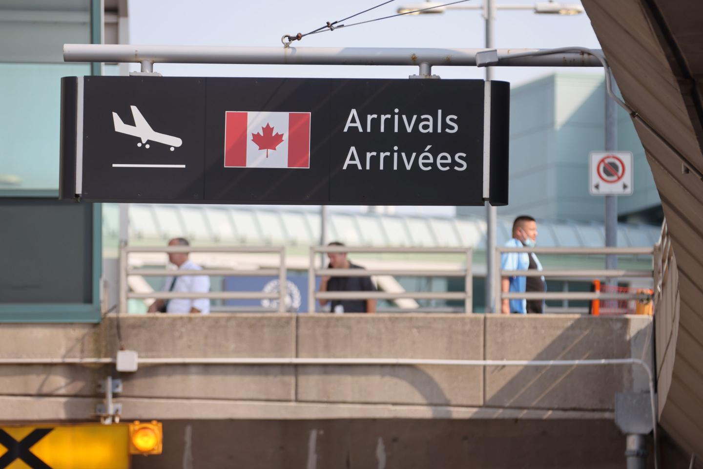 Travelers walk at Toronto Pearson International Airport on August 9, 2021 in Toronto, Canada.