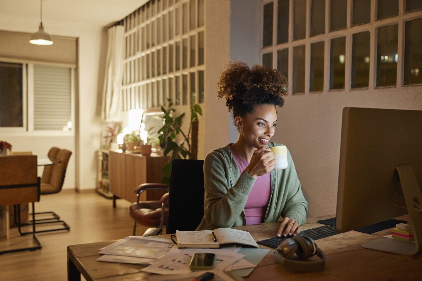 Young female working from home in the evening