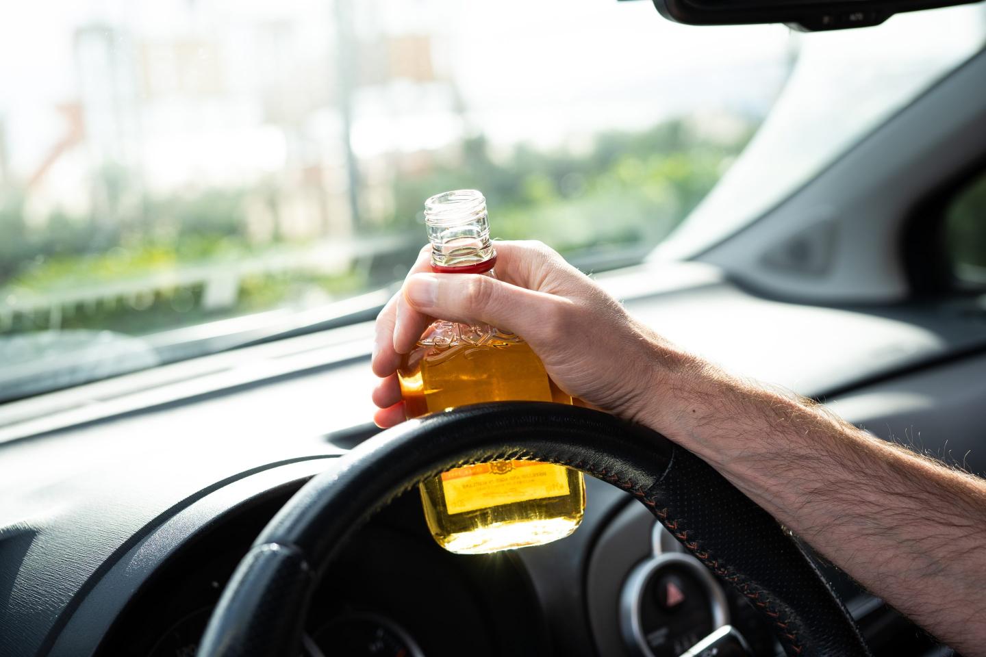 Boston and its liquor stores are standing off over a major tiny problem: Drinkers throwing tiny bottles out of their car windows