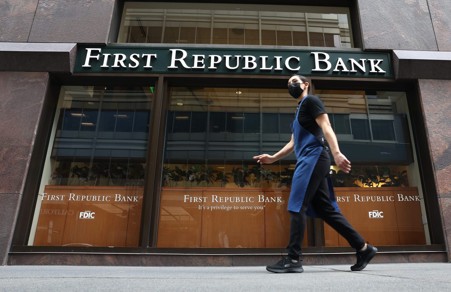 A person walks by the First Republic Bank headquarters on March 13, 2023 in San Francisco, California.
