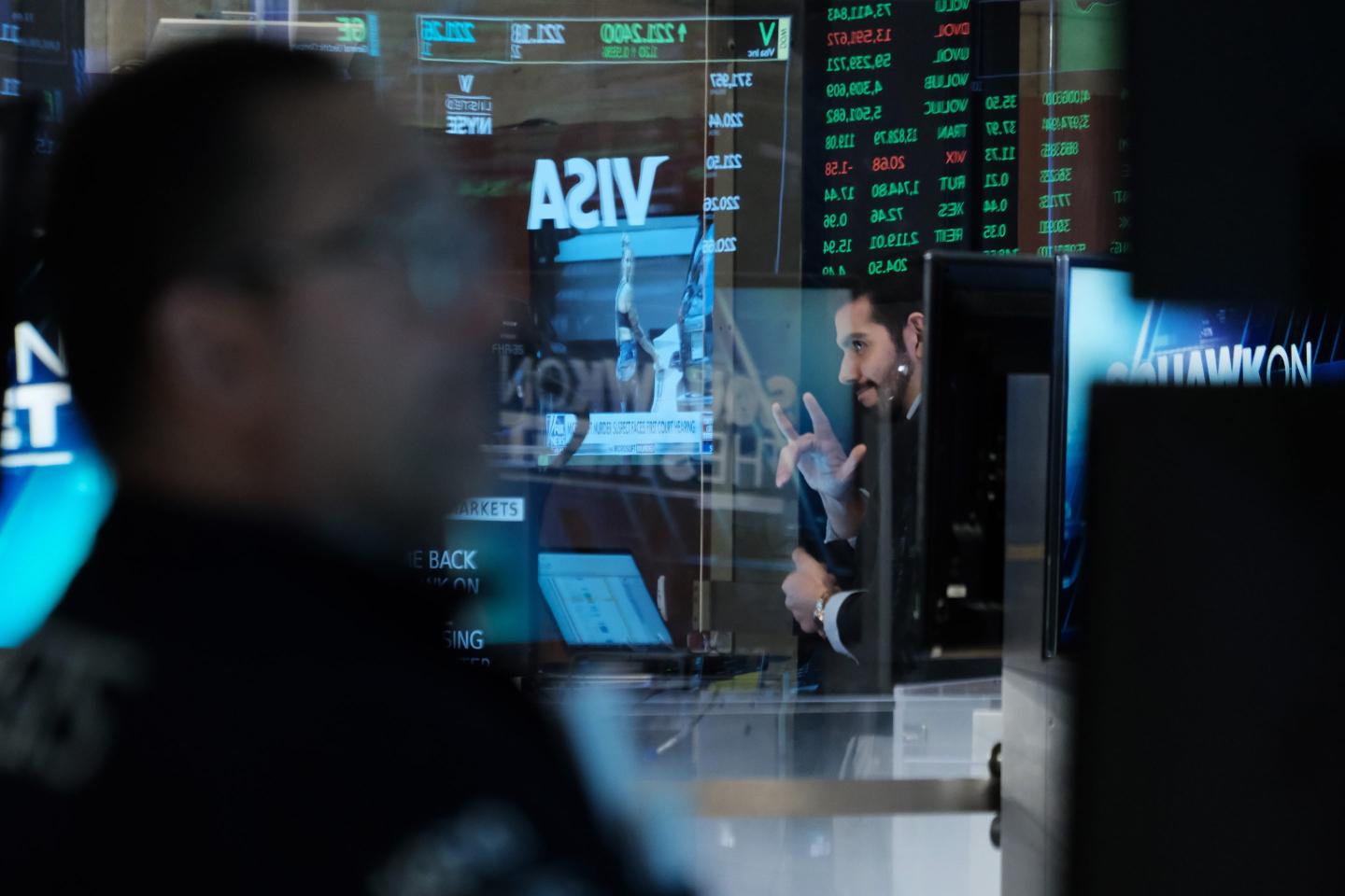 Traders work on the floor of the New York Stock Exchange (NYSE) on March 23, 2023 in New York City.