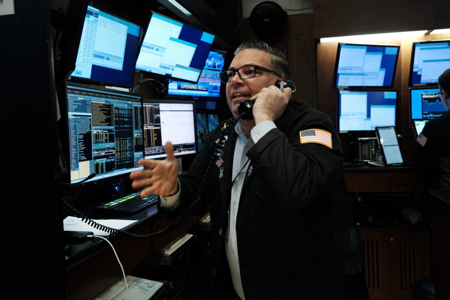 A person on the phone in the New York Stock Exchange