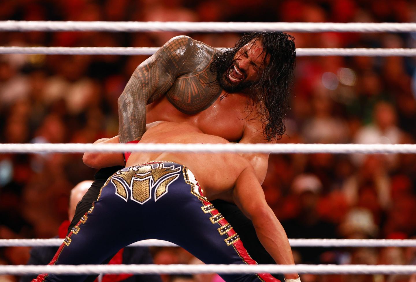 Roman Reigns wrestles Cody Rhodes