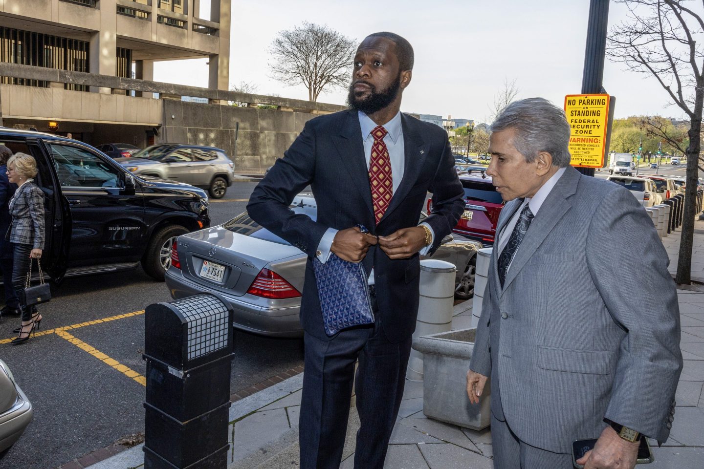 Pras Michel, a member of the 1990's hip-hop group the Fugees and his lawyer David Kenner (R) arrive at U.S. District Court on April 3, 2023 in Washington, DC.
