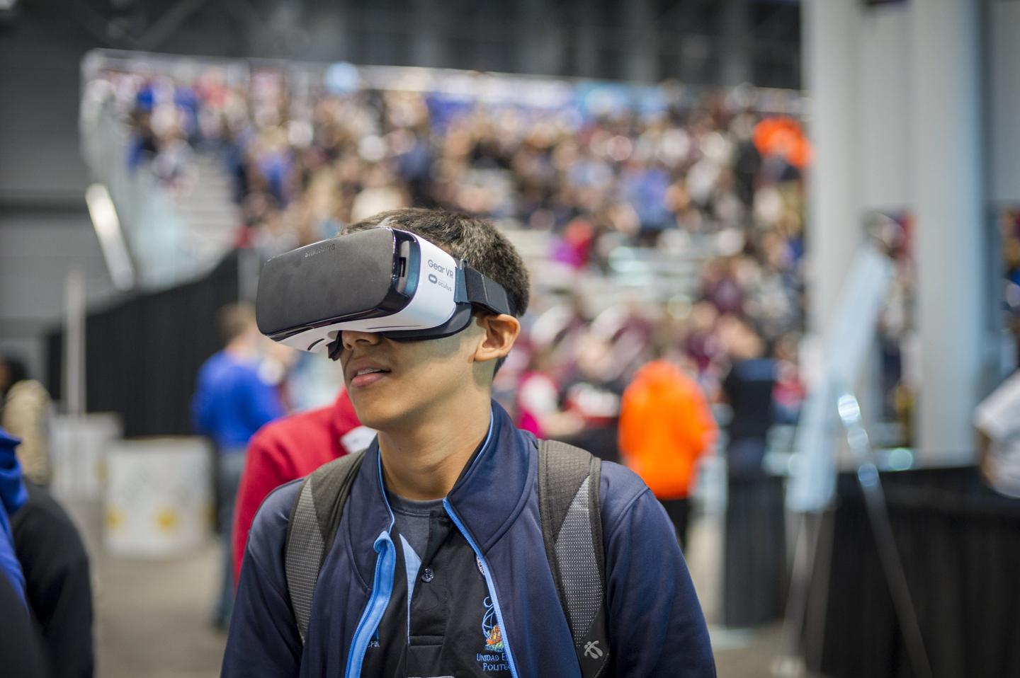 A young person using a virtual reality headset