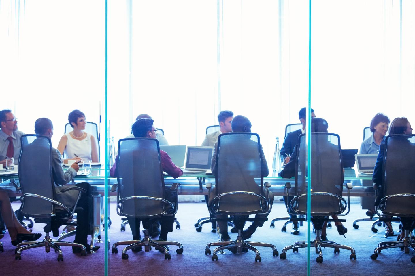 Business people having meeting in conference room.