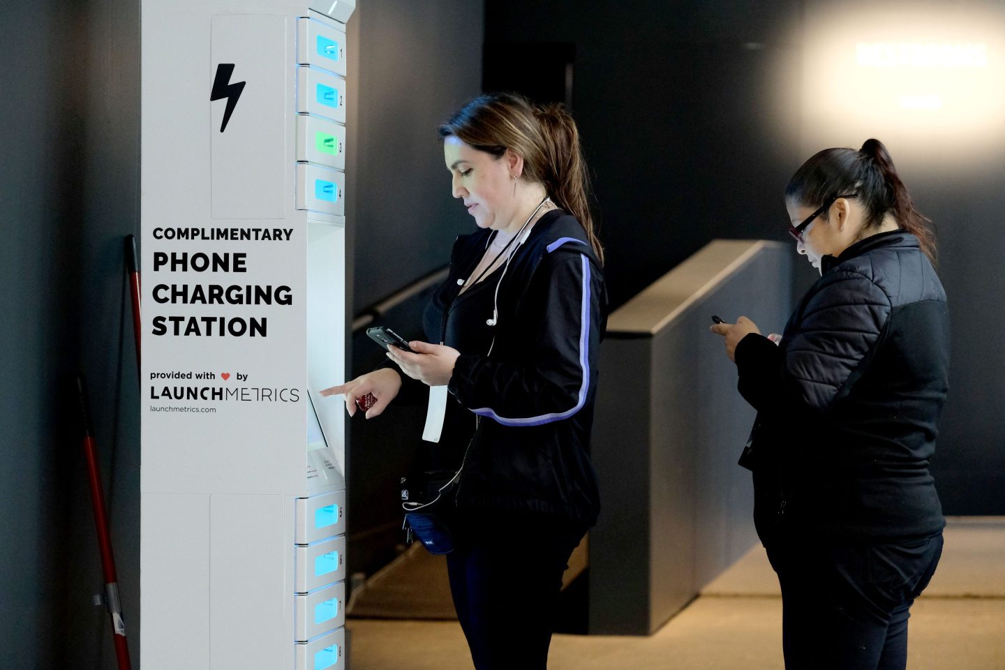A woman uses a mobile charging station in New York City.