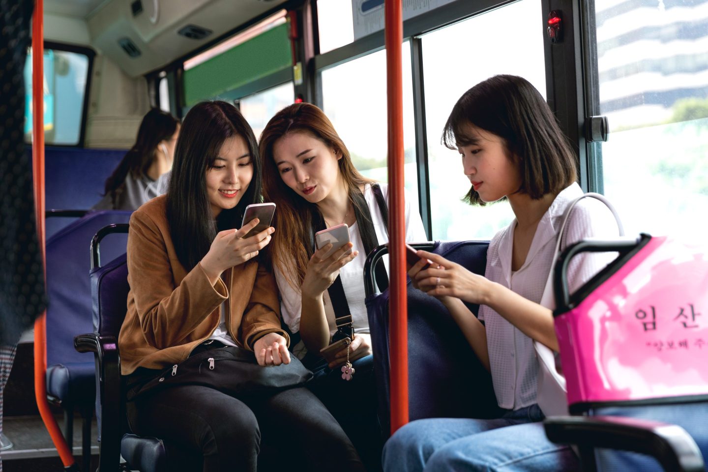 Young Korean women visiting Seoul by bus.