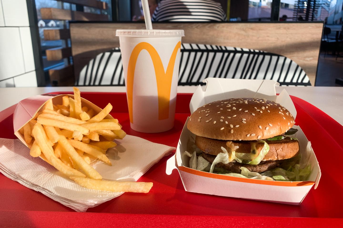 A tray with Big Mac, french fries and Coca-Cola is seen on a table.