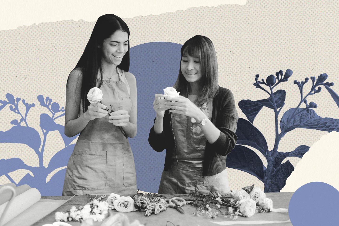 Photo of two women smiling making flower bouquets.