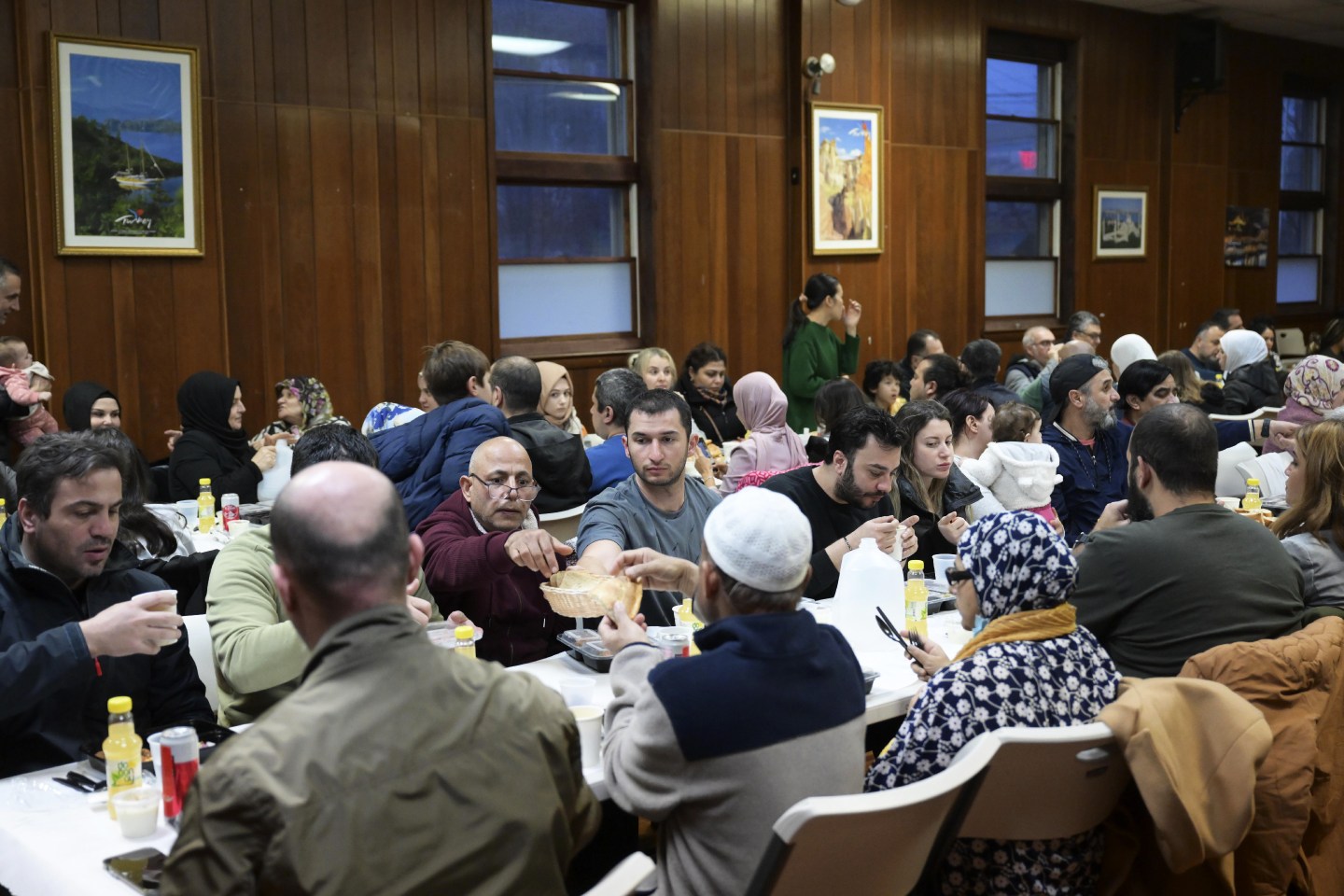 People gather at Bergen Diyanet Mosque and Cultural Center to break their fast.