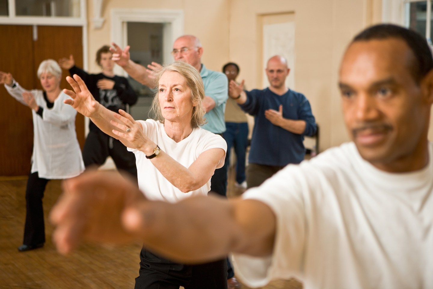 Senior and mature people during Tai Chi class