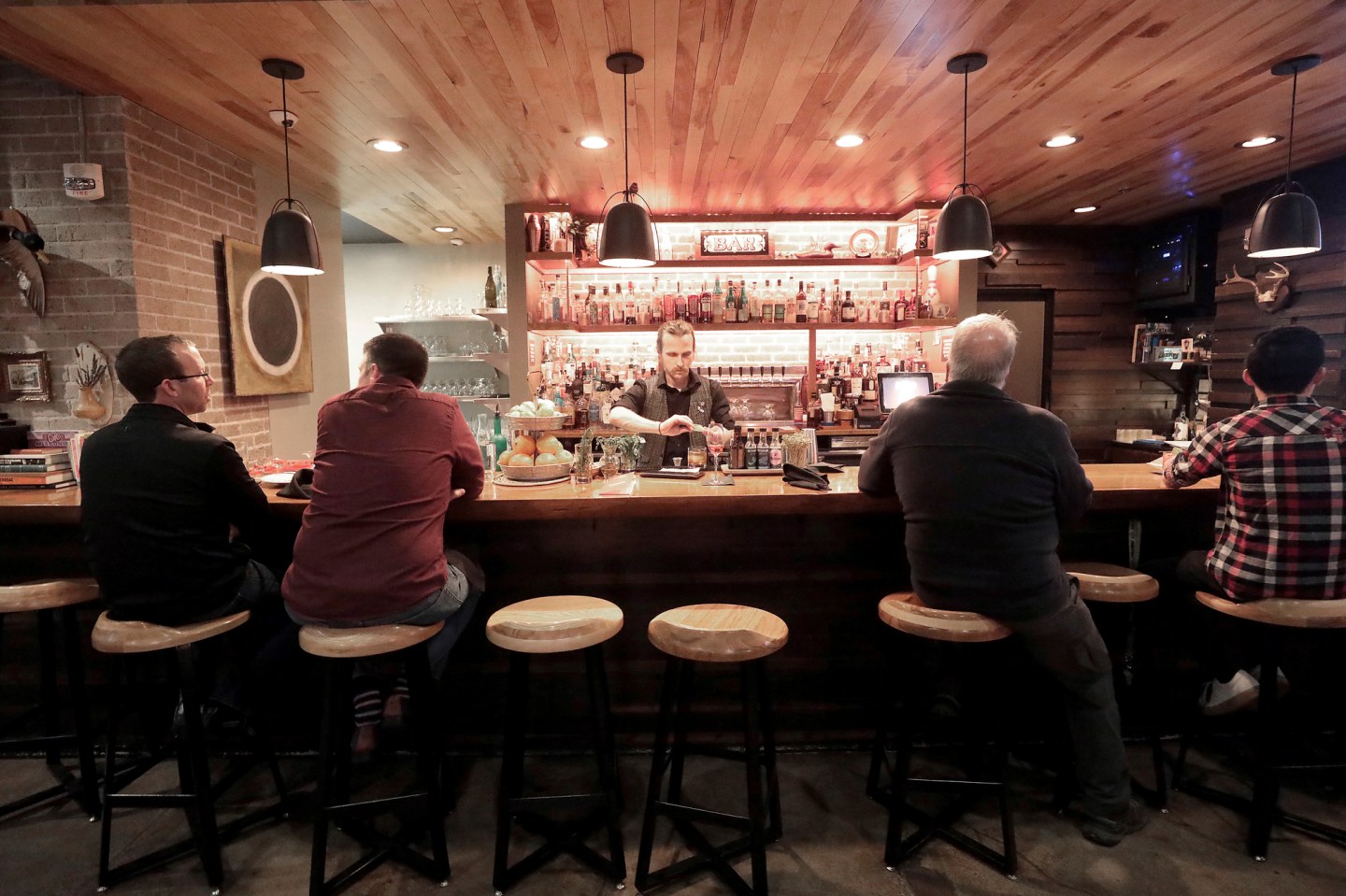 Patrons sit in a hotel bar in Eau Claire, Wis., May 1, 2019.