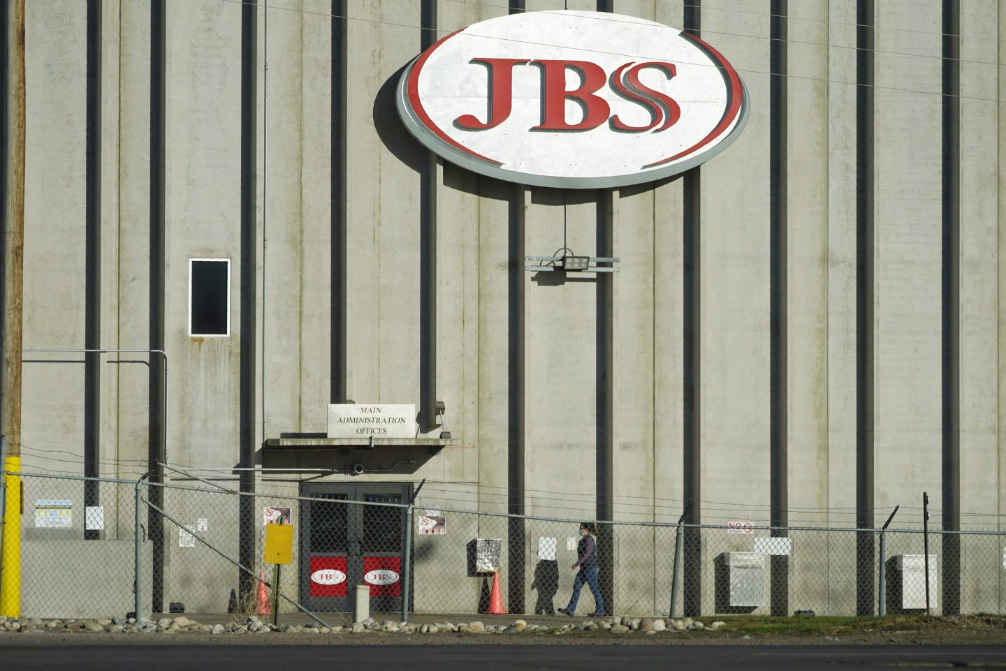 A worker heads into the JBS meatpacking plant in Greeley, Colo., Oct. 12, 2020.