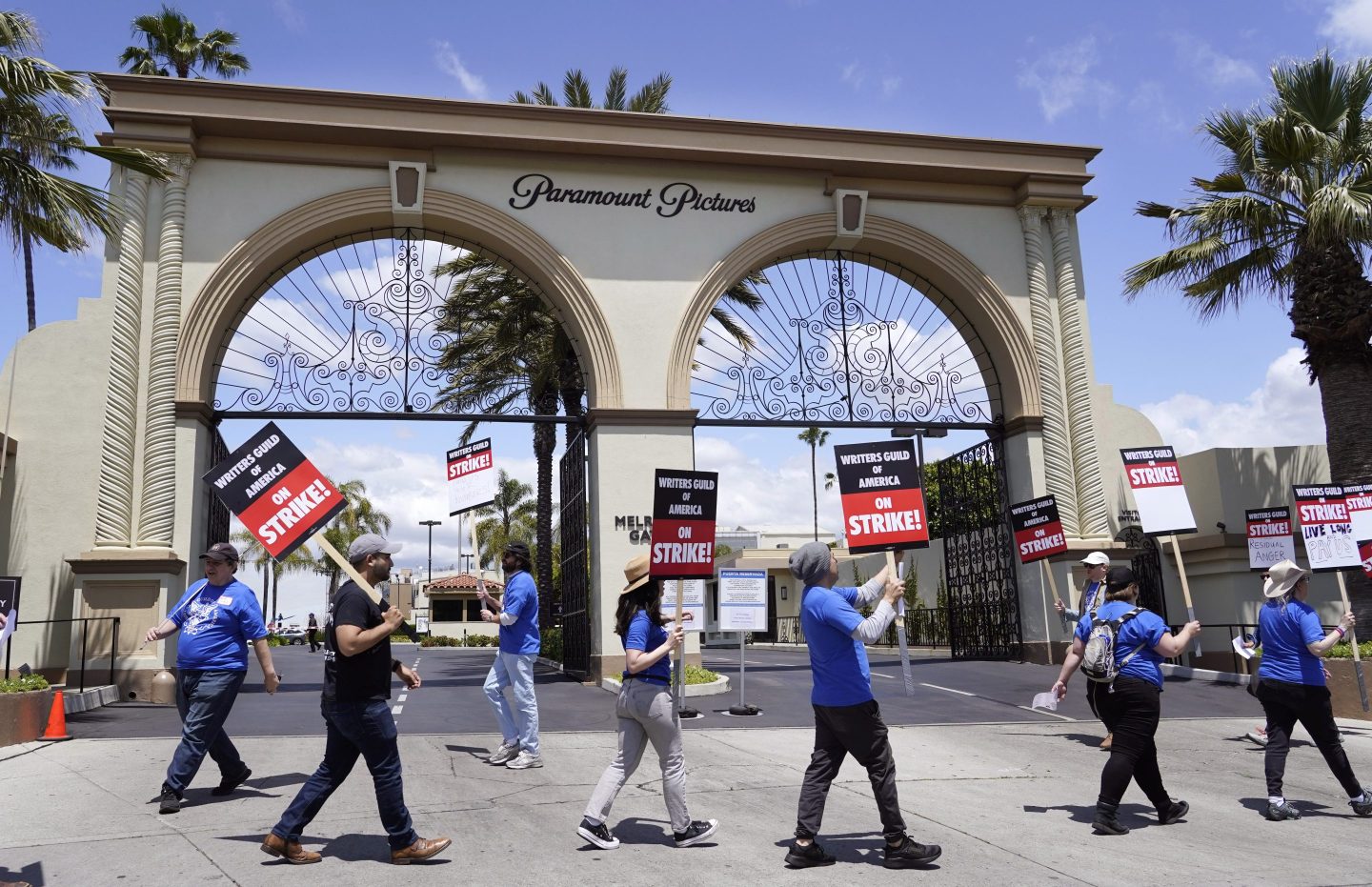 Members of the Writers Guild of America West picket at an entrance to Paramount Pictures, on May 2, 2023, in Los Angeles.