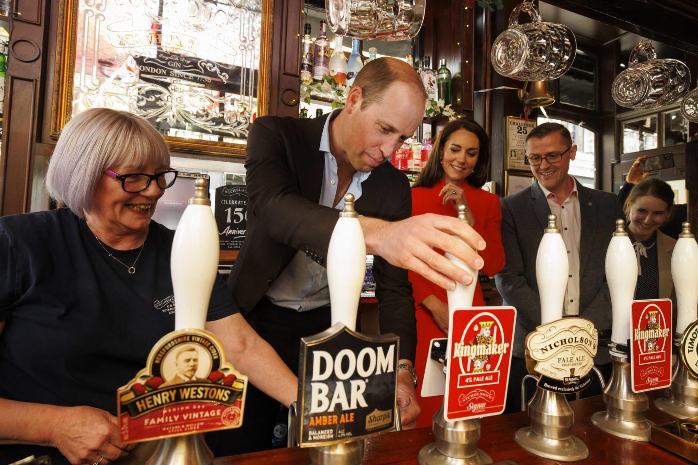 Prince William pours a pint with commoners and rides the tube ahead of his father’s coronation