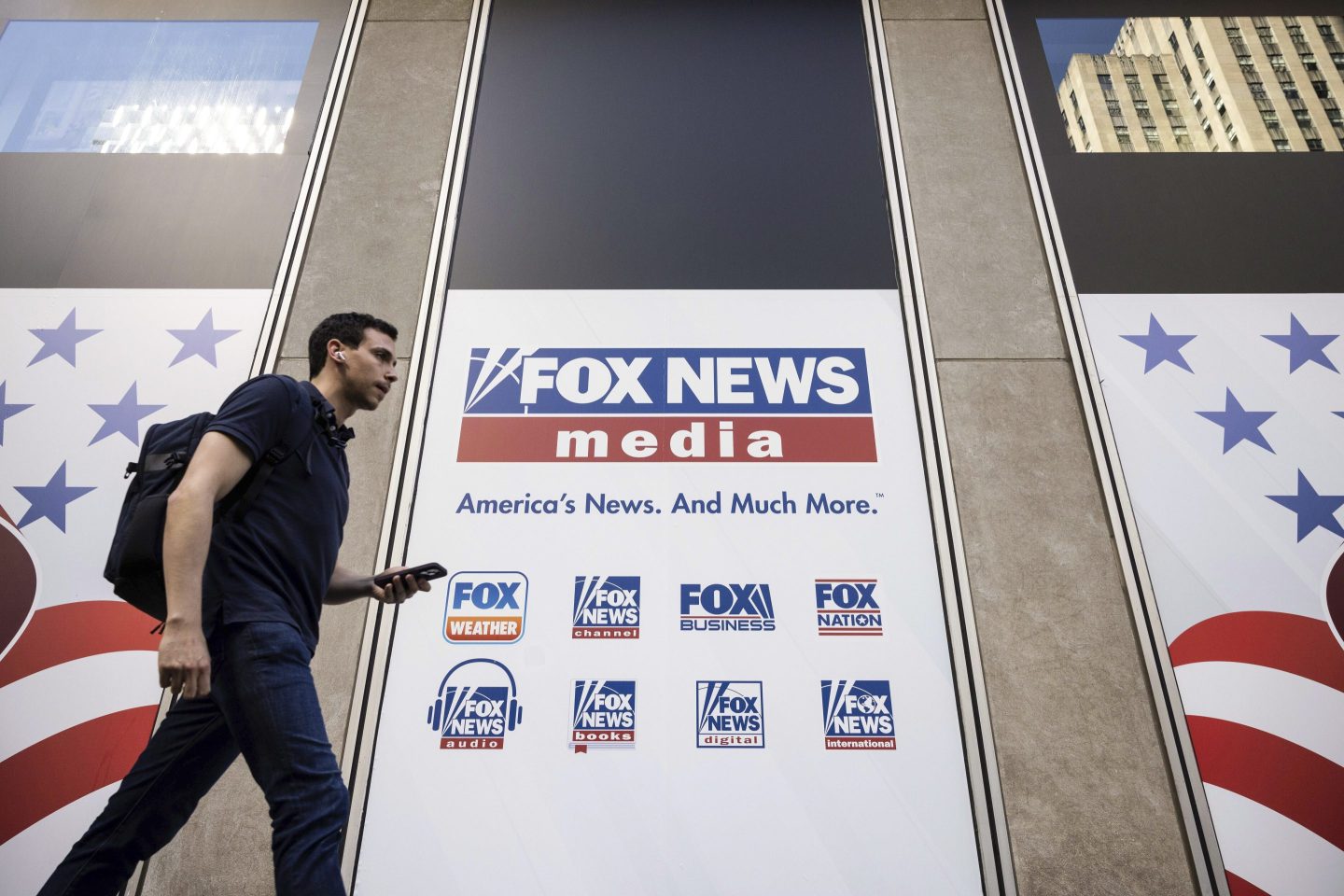 A person walks past the Fox News Headquarters in New York on April 12, 2023.