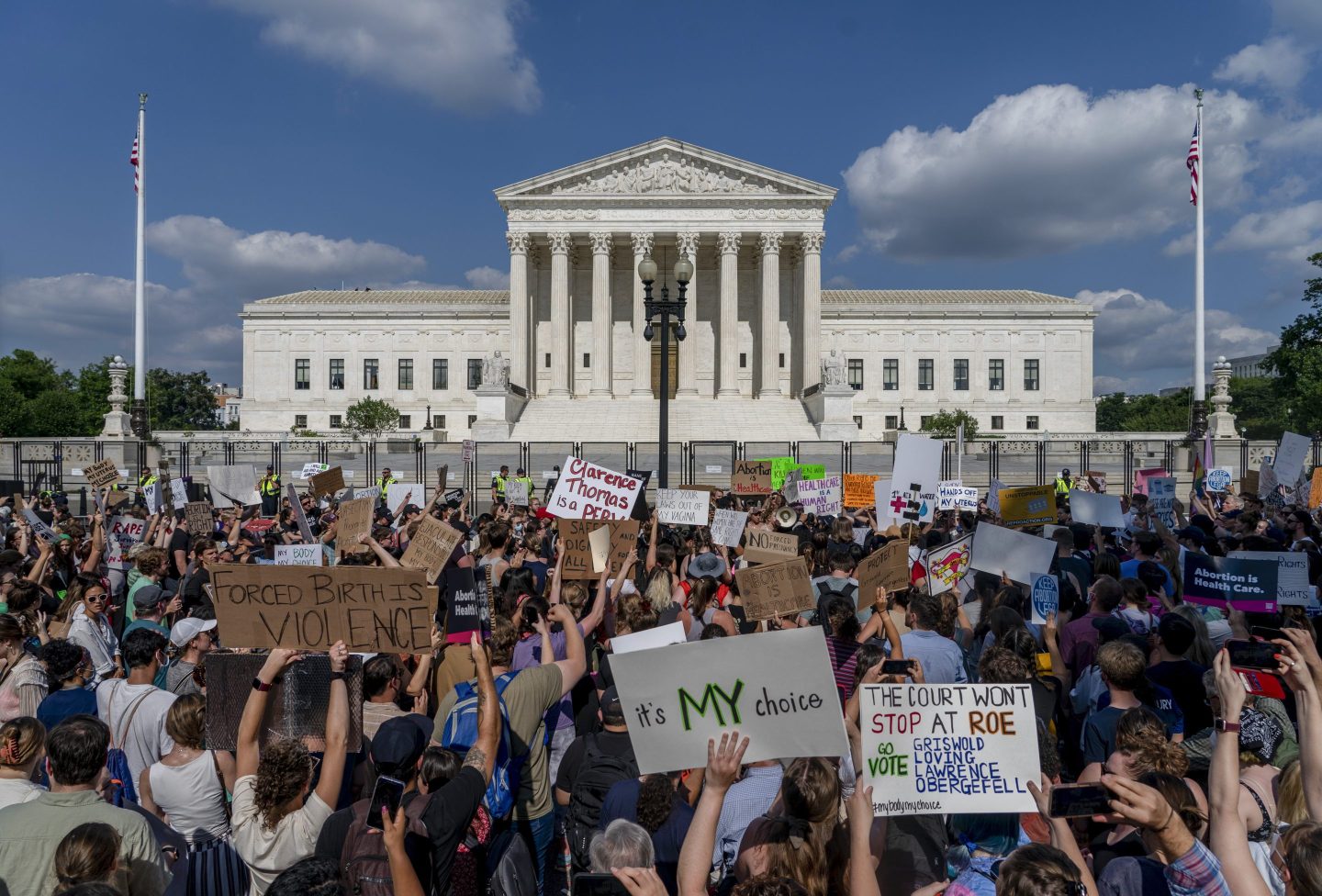 Abortion-rights and anti-abortion demonstrators gather outside of the Supreme Court in Washington, Friday, June 24, 2022.
