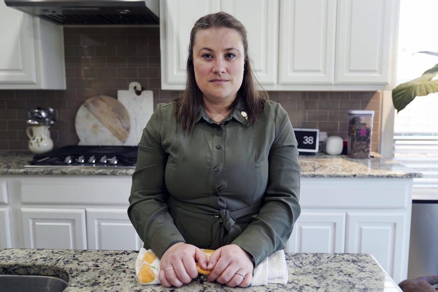 Jessica Bernardo poses for a photo at her home in Dallas, area on May 18, 2023. More Texas women who were told they could not end pregnancies with fatal fetal anomalies or that endangered their health are challenging the state's restrictive abortion laws.