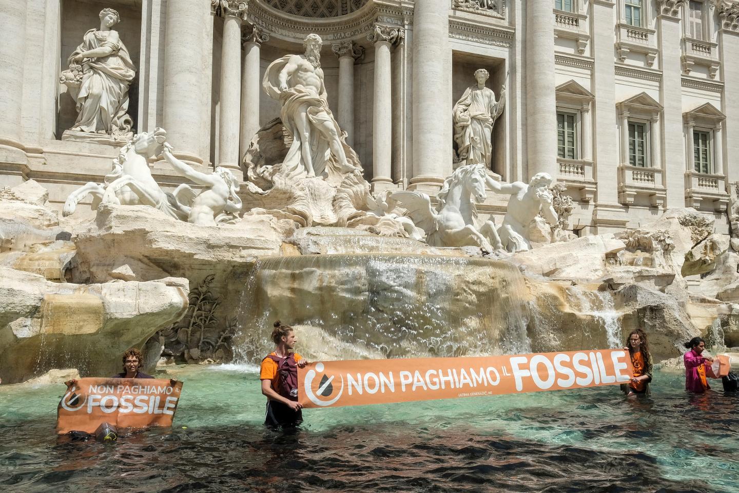 After Gen Zers threw tomato soup at a Van Gogh, now climate activists are dumping charcoal into Rome’s Trevi Fountain