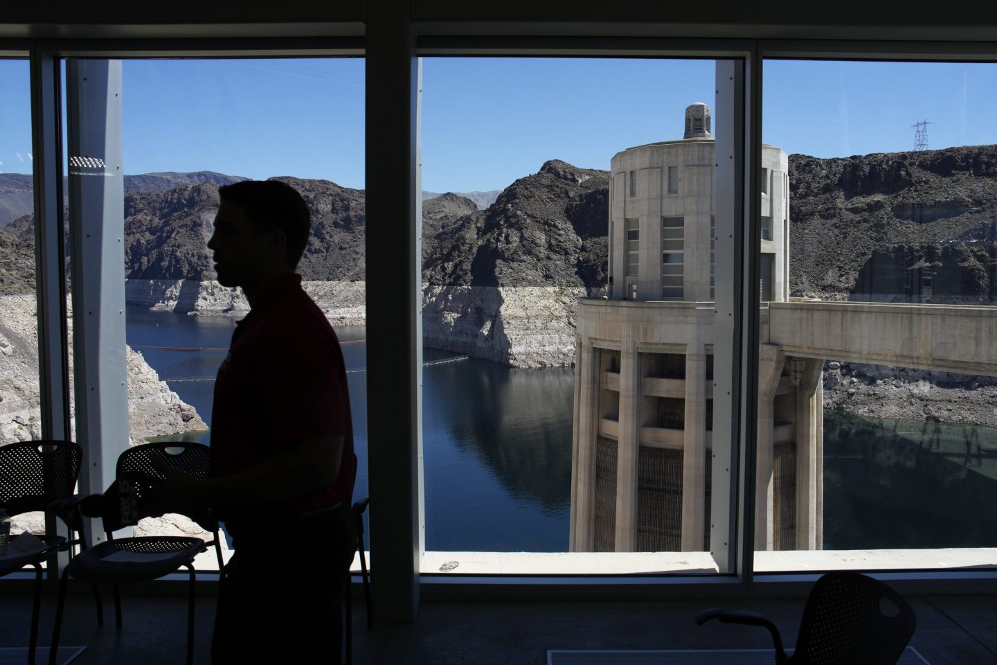People attend a news conference on Lake Mead at Hoover Dam, April 11, 2023, near Boulder City, Nev.