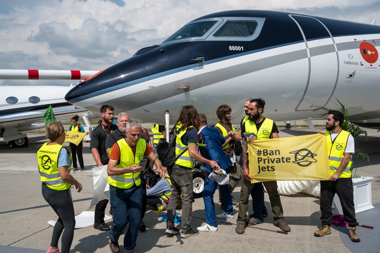 A hundred climate activists disrupted Europe’s biggest private jet sales fair, EBACE, to demand a ban on private jets.