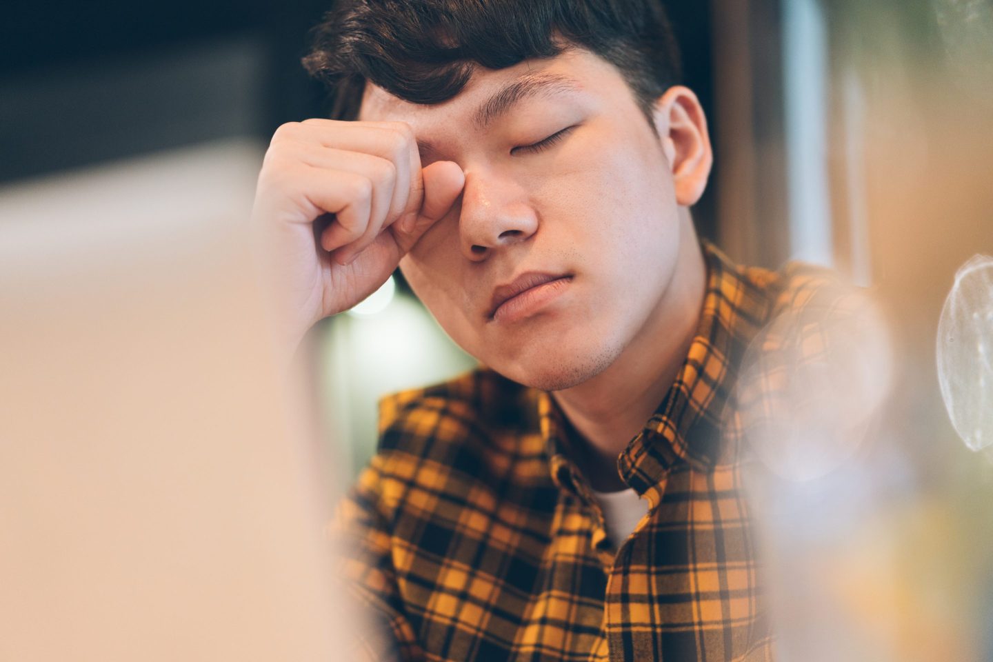 Millennial worker looking stressed out