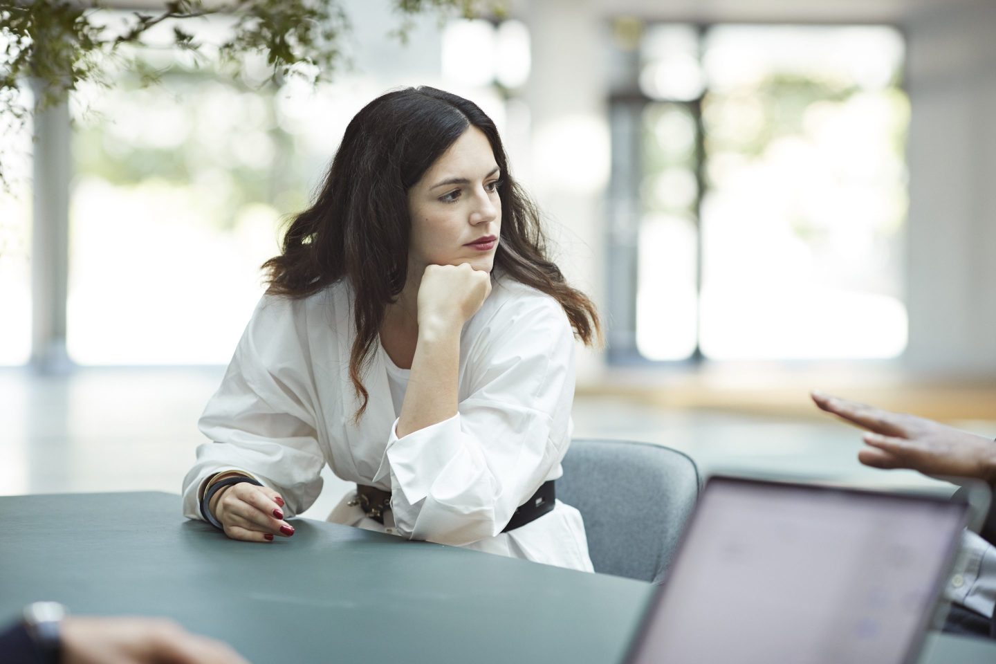 woman looking unhappy at desk