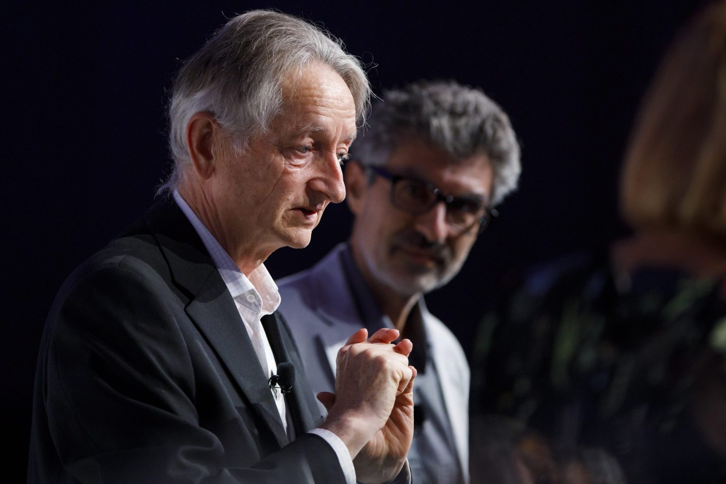 A picture of Geoffrey Hinton with his fists together