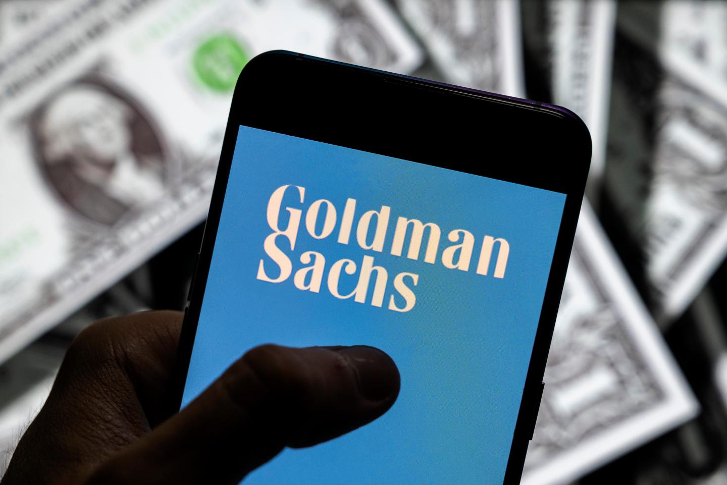A Goldman Sachs logo on a phone screen.