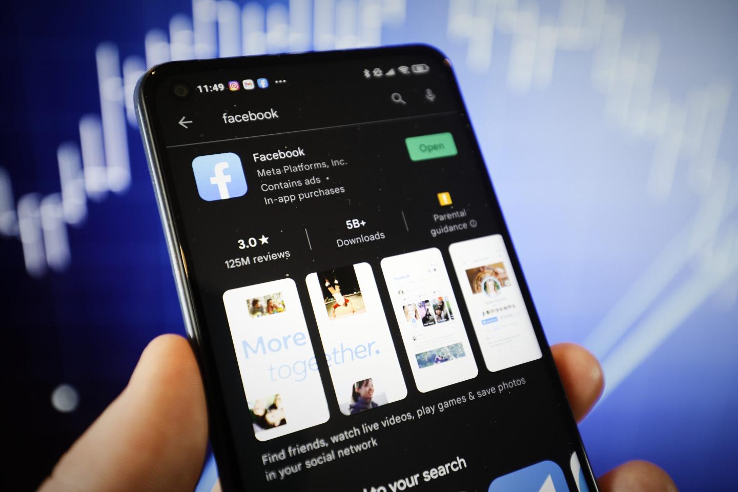 The Facebook app is seen on the Google Play store on a mobile device